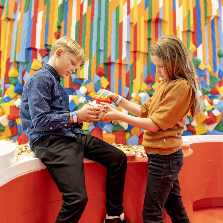 Children building and playing with LEGO bricks